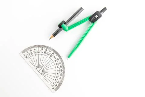 Green plastic compass with pencil 库存照片