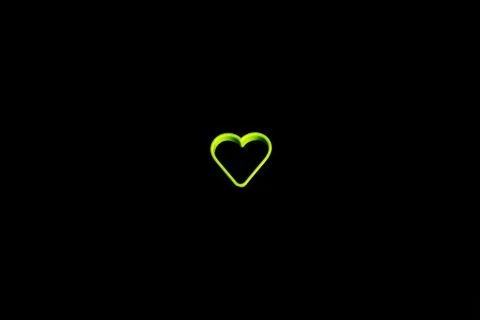 Green plastic cookie cutter for making cookies in the shape of a heart on a b Stock Photos