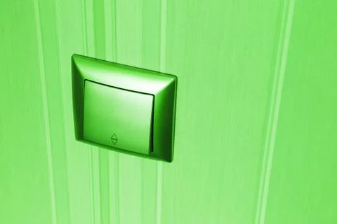 Green plastic electric light switch Stock Photos