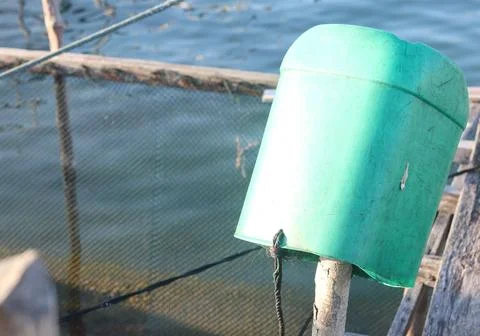 Green Plastic Float Canister on Marine Aquaculture Fish Farm Stock-Fotos