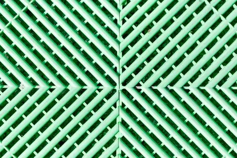 Green plastic flooring showing abstract geometric pattern Stock Photos