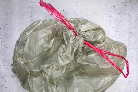 Green plastic garbage bag for plastic waste, ready to recycle, waste management Stock Photos
