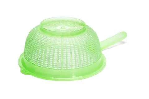 Green plastic kitchen strainer Stock Photos