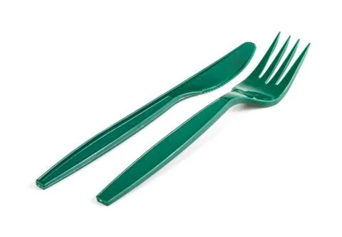 Green plastic knife and fork isolated on white background Stock Photos