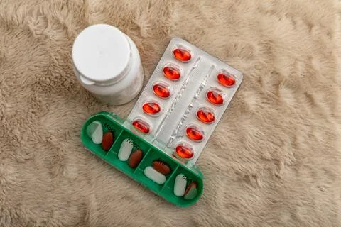 A green plastic pill storage container. Organizes pill storage for each day.. Stock Photos