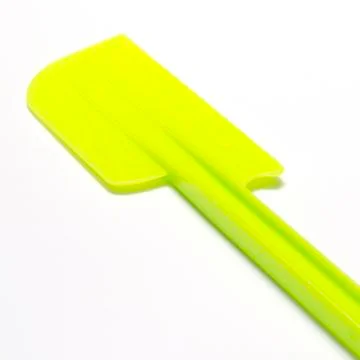 Green plastic spatula Stock Photos