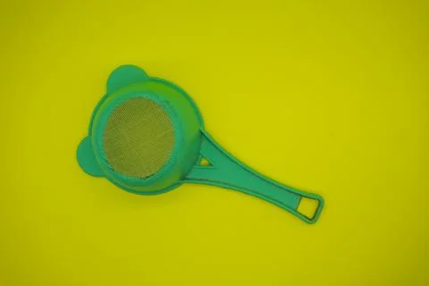 Green plastic strainer Stock Photos