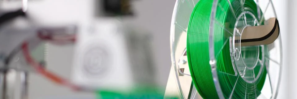 Green plastic string 3D printer consumable closeup Stock Photos