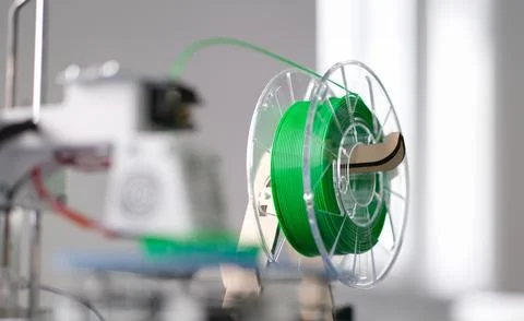 Green plastic string 3D printer consumable closeup Stock Photos