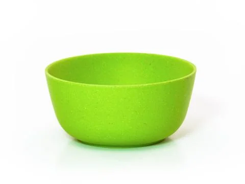 Green plastic tableware isolated on white background. Stock Photos