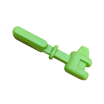 Green Plastic Toy Tool Stock-Fotos