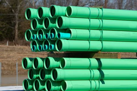 Green plastic tubes on a construction site plumber Stock Photos