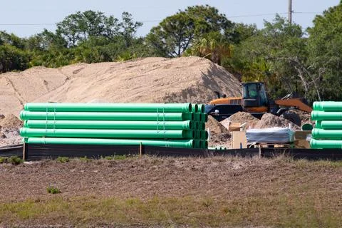 Green plastic tubes on a construction site Stock Photos