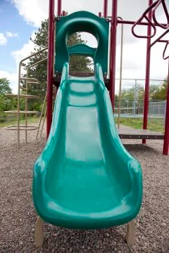 Green playground slide Foto stock