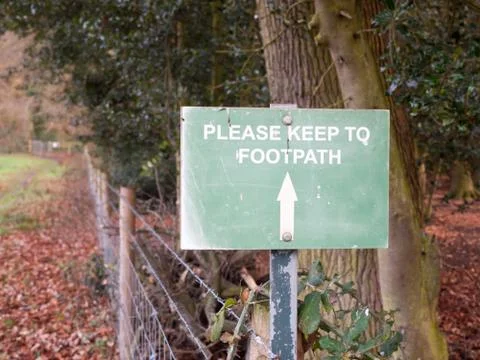 Green please keep to footpath path sign arrow way direction Stock Photos