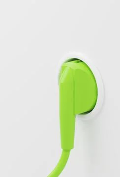 Green plug in a wall socket, green energy concept, energy transition, renewab Illustrazione stock