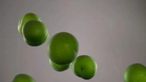 Green plums in water Stock Footage 197090735