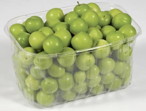 Green plums on white Stock Photos
