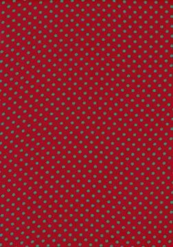 Green polka dot vintage pattern on red cloth texture 库存照片