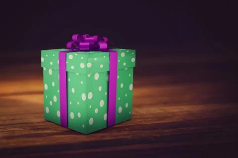 Green polka-dotted gift box with purple ribbon is resting on tabletop against Stock Illustration