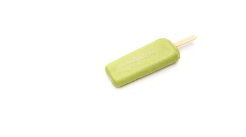 Green popsicle melting on a white background time-lapse, 4K Video Stock Footage 52360067