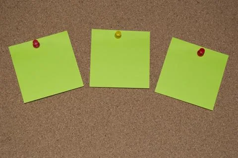 Green Post it Notes on a Cork Board Stock Photos