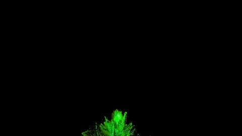 Green powder explosion on black background with quick acceleration and fall Stock Footage 122519093