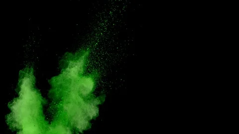 Green powder explosion. Slow motion movement from left of screen Stock Footage 122509314