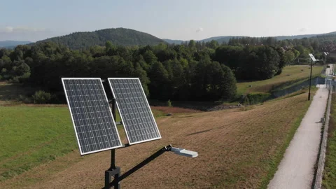 Green power generation by solar panels. Camera slowly rotating around Stock Footage 103607721