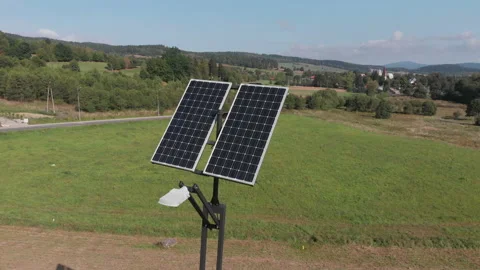 Green power generation by solar panels. Camera slowly rotating around Stock Footage 103684582