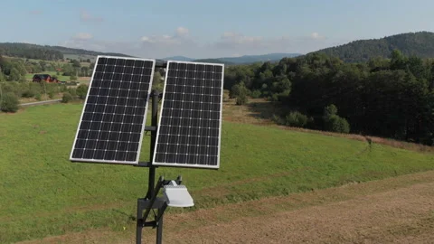 Green power generation by solar panels. Camera slowly rotating around Stock Footage 103690310