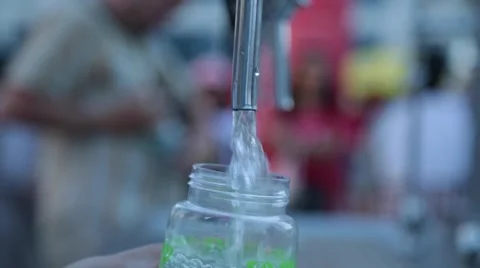 Green print bottle filled up with fresh water Stock Footage 51891334