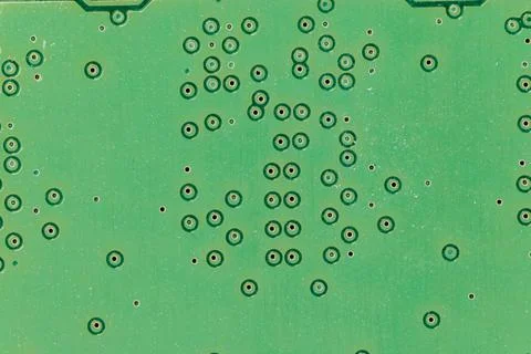 Green printed circuit board creating abstract pattern background Stock Photos
