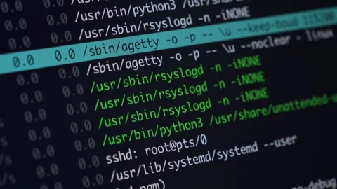 Green programming code on a dark monitor screen, showcasing complex system .. Stock Footage 318832052