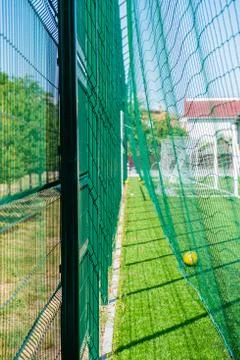 Green protective grid close-up. The pattern of a protective grid for a sports Stock Photos