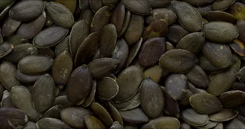 Green pumpkin seeds background texture. Stock Footage 297621171