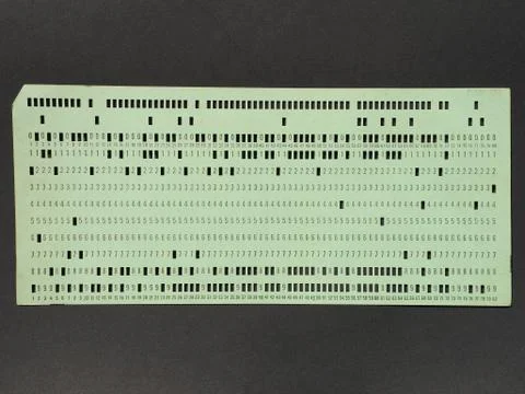 Green punched card for programming 库存照片