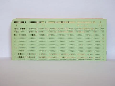 Green punched card for programming 스톡 사진
