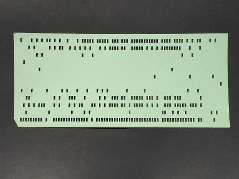Green punched card for programming Stockfoto's