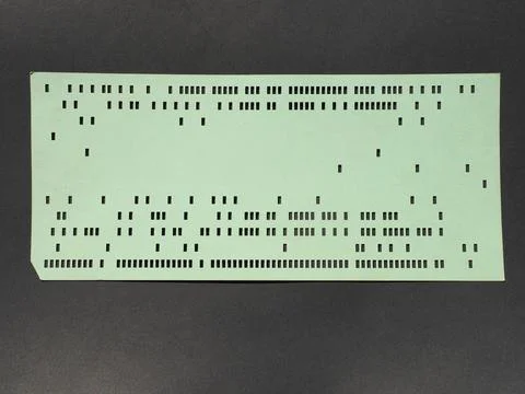 Green punched card for programming Stockfoto's