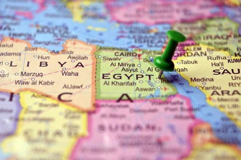 Green Push Pin Marking Egypt on Paper World Map Macro Close Up with Soft Bl.. Stock Photos