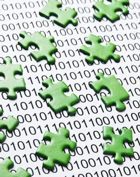 Green puzzles and binary code Stock Photos