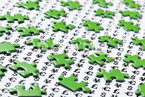 Green puzzles and symbols of money Stock Photos