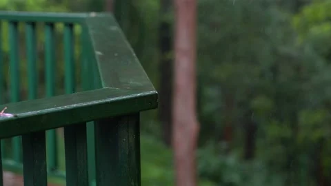 Green railing washed by a heavy rain. Stock Footage 131077860