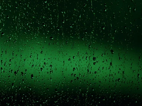 Green rain drops on window Stock Footage 76677335