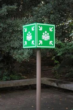 Green rallying sign in the middle of the image. Stock Photos