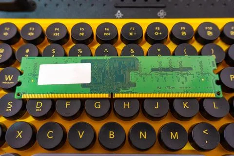 Green RAM Memory Module Bar on Mechanical Computer Keyboard Fotos Stock