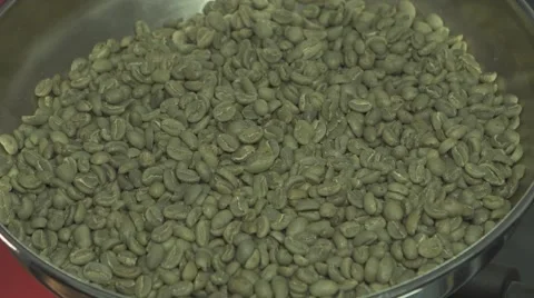 Green raw unroasted coffee beans in roaster Vídeos de archivo 67904542