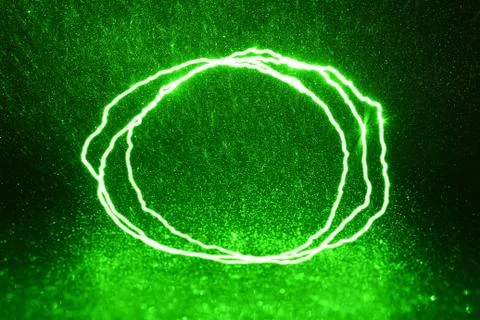 Green rays, lightning and glitter on a black background Stock Photos