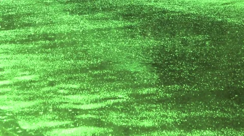 Green red asphalt in the rain background Stock Footage 66112434